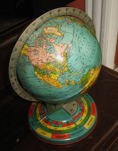 a globe on top of a wooden table