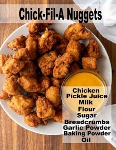 chicken nuggets on a plate with dipping sauce