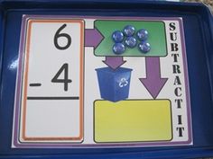 a blue tray with numbers and dices on it