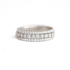 Item Details: Two 1.3mm white diamond eternity rings weighing approx. 0.75 ctw. each (G/VS). One pearl & diamond shared prong eternity band using 2mm pearl cabochons and diamonds. Crafted in your choice of 14K white, yellow, or rose gold. Please note, due to the "eternity" design of this ring, it is not resizable. Contact us below if you need assistance finding your ring size. Please allow 2-3 weeks for production and delivery.