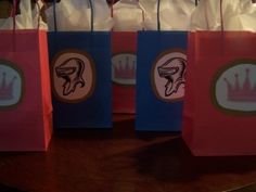 several bags with designs on them sitting on a table