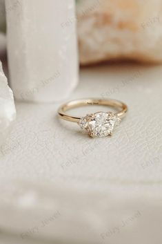 a diamond ring sitting on top of a table