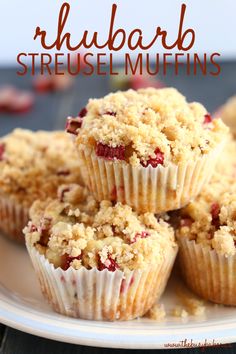 several muffins on a plate with the words rhubarb streusel muffins