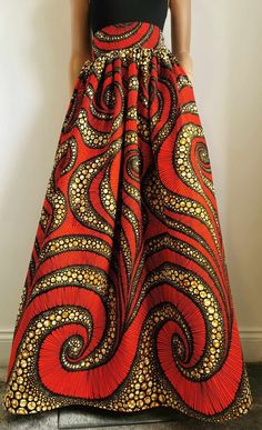 Handmade Unlined African Print Maxi / Full-Length Skirt     Elastic waistband skirt at the back     2 open side-entry pockets     Length: 46"     100% Wax Cotton     Handmade     Made in the UK (Colours may vary due to lighting on images. The product images are closest to the true colour of the product.) Red Maxi Skirt With Elastic Waistband, Red A-line Maxi Skirt With Lined Skirt, Red A-line Maxi Skirt With Lining, Flowy Orange Maxi Skirt With Elastic Waistband, Long Red Skirt With Pockets, Long Skirt With Wide Waistband, Red Full Skirt With Elastic Waistband, Red Full Skirt Bottoms With Pockets, Flowy Full-length Skirt With Pockets