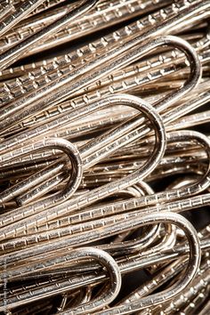 a pile of metal binders stacked on top of each other