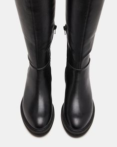 Expertly crafted with sleek black material, the LEZA BLACK boots feature a convenient inner zipper for easy wear and a stunning over-the-knee design.   1.5 inch heel height  Size 6 measurements: 12.5 inch shaft circumference, 17 inch shaft height Size 8 measurements: 14 inch shaft circumference, 22 inch shaft height Size 10 measurements: 15 inch shaft circumference, 22.5  inch shaft height Vegan leather upper material  Textile lining Synthetic sock  Synthetic sole  Imported Knee Boot, 5 Inch Heels, Easy Wear, Over The Knee Boots, Over The Knee, Women's Boots, Black Boots, Vegan Leather, Womens Boots