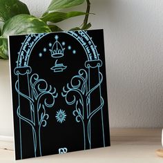 a black and blue art board with an intricate design on it