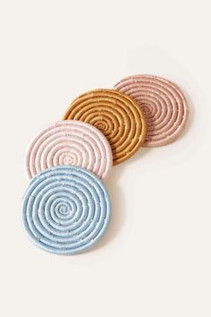 three cookies sitting on top of each other with different colors and shapes in the middle