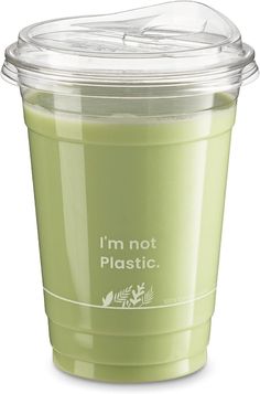 a plastic cup filled with green liquid