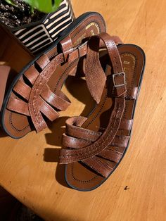 These boho chic strappy sandals are made from genuine leather in a warm brown colour with black rubber soles. They buckle around the heel and have a slight heel. Label: Diffusion (made in Brazil) Size: 6.5  Measurements: Heal to toe - 9.25" Widest part of foot - 3.4" Great vintage condition - normal signs of wear Feel free to message me for more measurements, pictures, or to ask any other questions you might have! Please see my shop policies regarding shipping. Standard shipping does not include Sling Back Sandals, Brown Colour, Warm Brown, Sling Back, Black Rubber, Strappy Sandals, Shop Policies, Women's Shoes Sandals, Brown Color