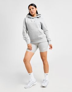 Layer up in classic Swoosh with this women's Phoenix Fleece Hoodie from Nike. In a Dark Grey Heather colourway, this regular-fit pullover is made from signature brushed fleece fabric for plush comfort. It features elongated ribbed trims, a drawcord-adjustable hood and a kangaroo pocket for your essentials. Finished off with the iconic Nike logo embroidered to the chest. Machine washable. | Our model is 5'8.5" and wears a size small. Nike Phoenix Fleece, Football Calendar, Nike React Vision, 270 Nike, Chest Machine, Norwich City, Football Training, All Team, Football Kits