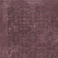 an antique rug with floral design in purple tones