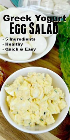 two bowls filled with egg salad on top of a wooden cutting board next to lettuce