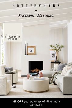 a living room with white furniture and a fire place in the center is an advertisement for pottery barn