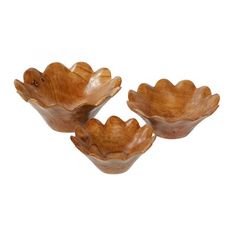 three wooden bowls sitting on top of each other