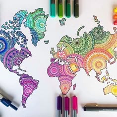 the world map is drawn with markers and crayons