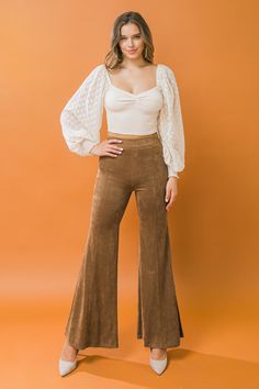 These UNTIL I FOUND YOU SUEDE PANTS will add a touch of sophistication to any ensemble. Crafted with a luxuriously soft faux suede material, they feature a fashionable fit and flare silhouette that is secured with a side zipper closure for a secure fit. Perfect for any stylish occasion. Details Self: 90% Polyester 10% Spandex Size & Fit - Model is 5`8" And Wearing Size Small - Measurements Taken From Size Small - Approx. Length: 44" Velvet Elvis, Smooth Talker, Suede Pants, Found You, I Found You, Suede Material, Vintage Inspired Design, Faux Suede, Side Zipper