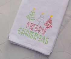 a white towel with merry christmas written on it