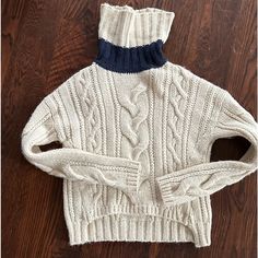 Cozy Luxe Cream Wool Turtleneck Sweater With Wide Navy Stripe Detail At The Neck. Elevated Nautical Fisherman’s Sweater Vibe. Perfect Condition, Unworn But No Tags. Interesting Shirt Hem Detail. Looser Fit. Cozy, Luxurious, Chic. Wool Turtleneck Sweater, Chunky Cable Knit Sweater, Chunky Cable Knit, Sweater Cream, Wool Turtleneck, Cable Knit Sweater, Navy Stripes, Turtleneck Sweater, Juicy Couture