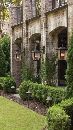 an outdoor area with several lights and bushes