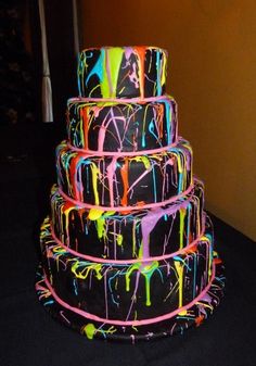 an image of a cake with neon paint on it