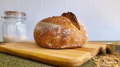 a loaf of bread sitting on top of a cutting board