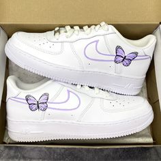 authentic white Nike Air Force 1 custom sneakers hand painted lilac purple lines on the swooshes with 1 butterfly on the outsides of the sneakers on the insides of the sneakers lilac purple lines on the swooshes All sneakers are made on order, please allow the indicated time for your item to be shipped. If you have any questions about the process time or do you need the sneakers quickly? Just send us a message!   * Be aware of your sneaker size, please in doubt go to the store first * Sneakers c Butterfly Shoes Air Forces, Purple Nike Air Shoes, Nike High Tops Double Swoosh Purple, Nike Butterfly Shoes Purple, Hand Painted Air Force 1 Purple, Custom Air Force 1 Butterfly And Flowers, Purple Nike Air Force 1, Nike Shoes Women Lavender, Purple And Lilac Shoes