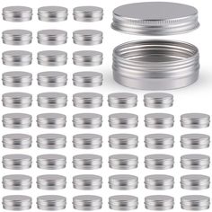 a large group of silver tins on a white background