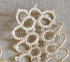 several pieces of white crochet sitting on top of a table