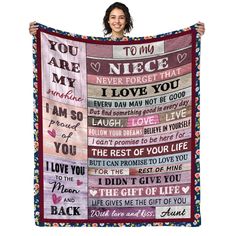 a woman holding up a blanket with the words you are my and i love you