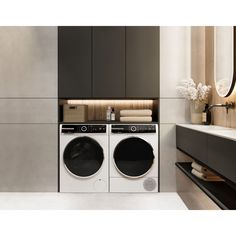 a washer and dryer in a modern bathroom