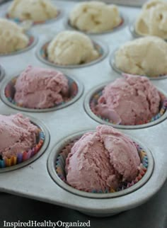 a muffin tin filled with pink ice cream