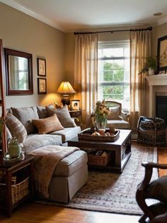 a living room filled with furniture and a fire place in front of a large window