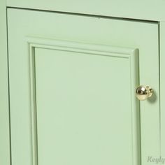 a close up of a green cabinet door