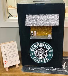 the starbucks coffee machine is decorated with glitter