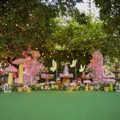 an outdoor party setup with fairy decorations