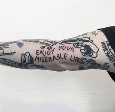 a tattooed arm with words on it