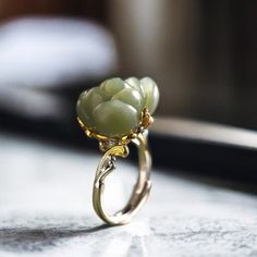 Elevate your style with our stunning silver ring featuring a vibrant jade flower. Handcrafted with meticulous attention to detail, this nature-inspired piece exudes elegance and uniqueness. Jade is revered for its healing properties, believed to bring balance and harmony to the wearer, promoting peace and prosperity. Whether you're treating yourself or searching for the perfect gift, this statement jewelry piece is sure to dazzle while imparting the soothing energy of jade. Add a touch of nature Luxury Jade Wedding Ring, Nature-inspired Flower Gemstone Jewelry, Exquisite Flower Shaped Gemstone Rings, Elegant Carved Flower Jewelry, Green Flower-shaped Jewelry For Anniversary, Green Flower-shaped Anniversary Jewelry, Green Flower Shaped Anniversary Jewelry, Elegant Silver Jade Ring, Spiritual Jade Jewelry For Weddings