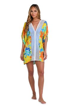 This bright and cheerful floral print has a summery vibe, perfect for a beach day. Styled with breezy dolman sleeves and a flowy fit, this cover-up is finished with crochet trim, braided ties, and thread tassels for a playful touch. [split] Details V-neck caftan Ties at neck Dolman sleeves Braided ties with thread tassels Breezy silhouette Fabric 100% Rayon Crepe Vibrant Print V-neck Kaftan For Beachwear, Multicolor V-neck Cover-up For Beach Party, Beachy Multicolor V-neck Cover-up, Bohemian V-neck Cover-up With Floral Print, Bohemian V-neck Floral Print Cover-up, Summer V-neck Cover-up With Tropical Print, Beachy Multicolor V-neck Swimwear, Spring Multicolor Swimwear For Beach Cover-up, Multicolor Flowy Cover-up For Beach Party