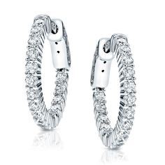 These elegant diamond hoop earrings feature 2.00 ct. tw. round-cut lab grown diamonds in shared prong setting. The hoop earrings are available in your choice of 14k white or yellow gold and fasten securely with safety locks. Black Diamond Pendant, Black Diamond Studs, Halo Diamond Earrings, Solitaire Diamond Pendant, Colored Diamond Rings, Halo Earrings, Black Diamond Ring, Gemstone Studs, Brown Diamond