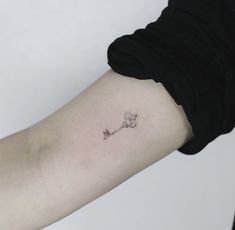 a person with a small tattoo on their arm