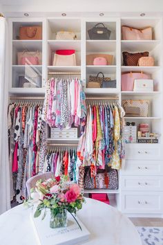 the closet is full of clothes and purses