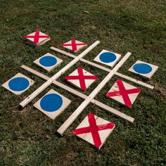 wooden tic - tac - toe game with red, white and blue crosses