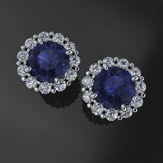 Simple. Sleek. Sexy dark blue lab grown sapphires surrounded by diamonds. These gorgeous earrings have two .5 carat lab grown sapphires each set in 14k gold settings, with nearly a half carat of diamonds to boot. Choose from 14k yellow, white or rose gold.Note: The photos are not exact, they are renders. The finished earrings will have the typical notched earring post, matching ear nuts, etc.[[----- GEMSTONE DETAILS -----]]Two 5mm round dark blue lab grown sapphires, .5 carat each.Twenty 1.6mm r Halo Diamond Earrings, Sapphire And Diamond Earrings, Halo Earrings, Blue Sapphire Diamond, Earring Post, Gold Halo, Big Earrings, Small Earrings, Gorgeous Earrings