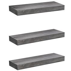 three shelves made out of concrete are shown