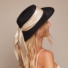 Black textured hemp boater with ivory shiny satin ruched band and tails. Measurements: 6.5" X 2.75" X 3.25" One Size. SKU: 21018-13124 Summer Evening Fedora With Short Brim, Chic Summer Fedora For Formal Occasions, Chic Summer Top Hat For Formal Occasions, Chic Fitted Cream Straw Hat, Kentucky Derby Fedora Boater Hat With Ribbon, Elegant Straw Hat With Ribbon For Kentucky Derby, Summer Evening Boater Hat With Flat Brim, Classic Summer Evening Boater Hat, Chic Boater Hat For Summer Evenings