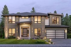 a two story house with lots of windows and grass in front of it at dusk