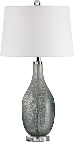 a glass table lamp with a white shade on the base and a silver metal frame