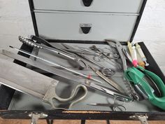 an open suitcase filled with lots of different tools