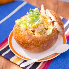 a bowl filled with food sitting on top of a plate